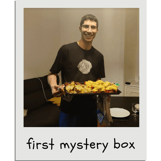 Here, a MysteryBox™ chef Mattia presents his final product - peppers stuffed with something questionable, with a side of roasted vegetables