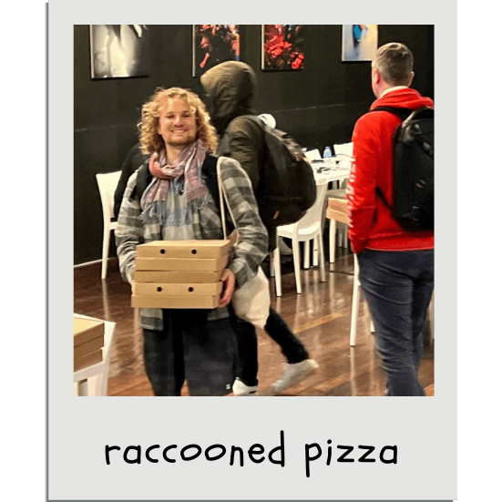 Here is a picture of Quentin (with Romain and Daniel from WorkPi in the background) during an evening where we 'raccooned' probably over 10 free pizzas after the hackathon organizers brought out too many. We ate pizzas for the following days, reheated at our apartment.